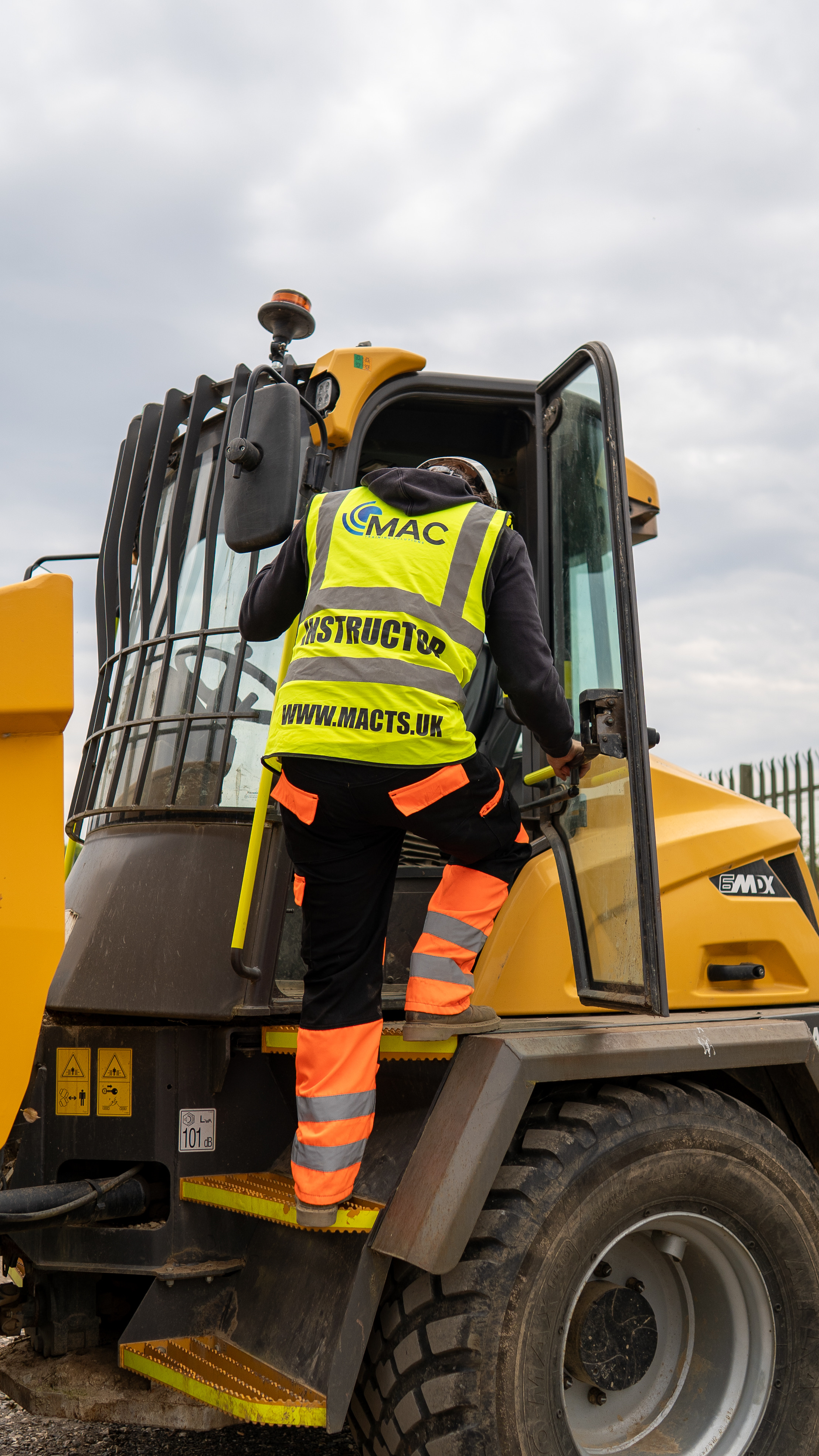 MAC instructor climbing into a forward tipping site dumper