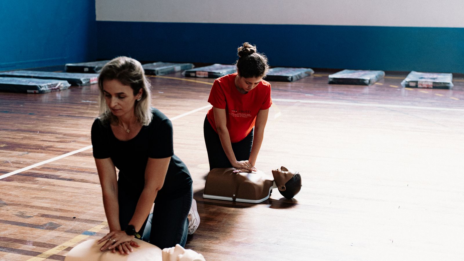 First aid CPR training session on mannequins