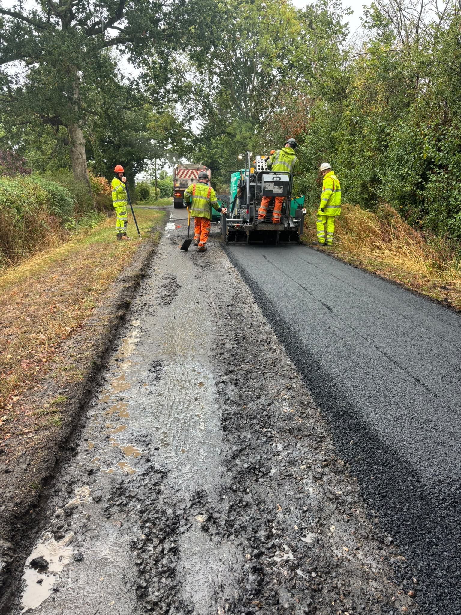 MAC street works crew laying asphalt on a road