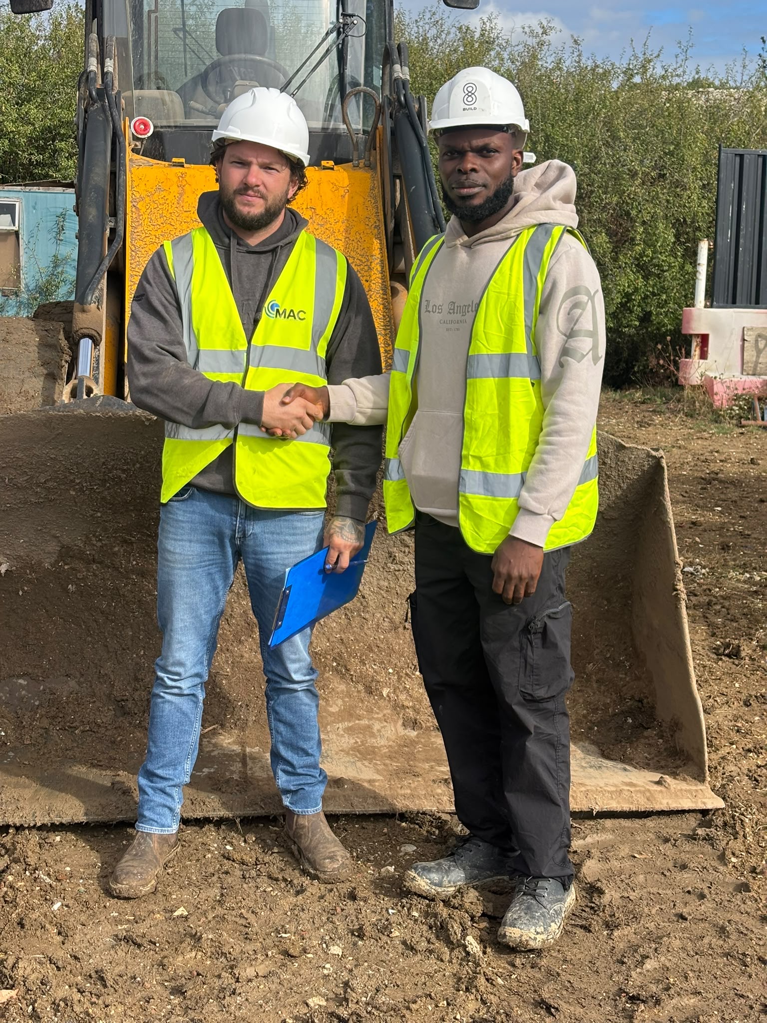 MAC instructor congratulating an operator after passing their NPORS test